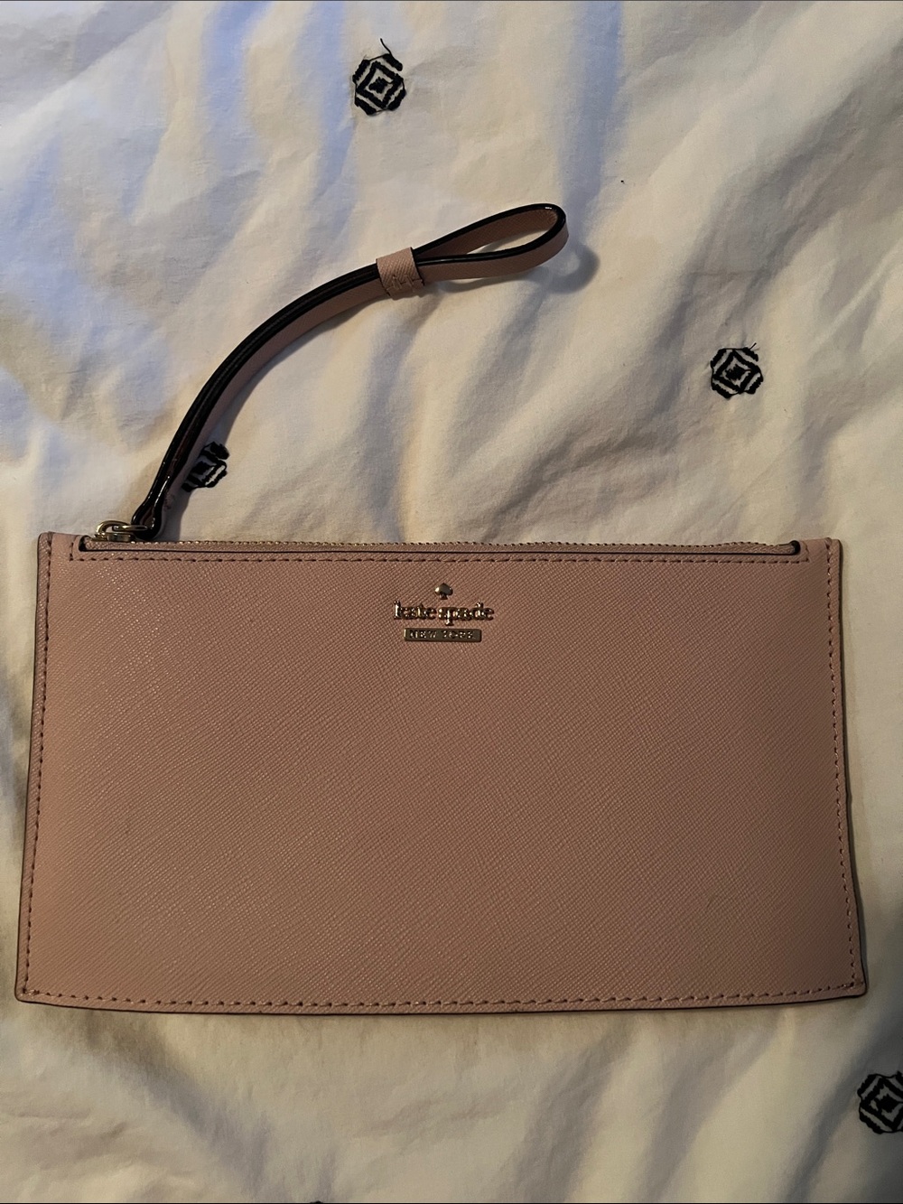 kate spade pale pink saffiano zip clutch with gold logo
